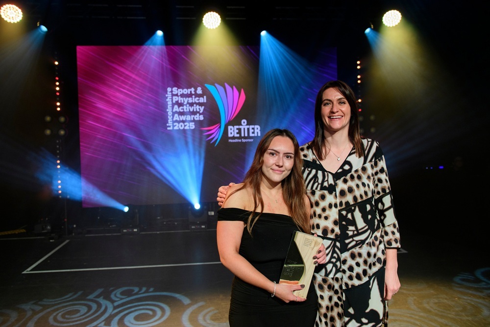 Millie Briggs (left) collects the Impact on Health Award for Apricity Yoga, presented by sponsor Nathalie Cook, Appoint Consulting